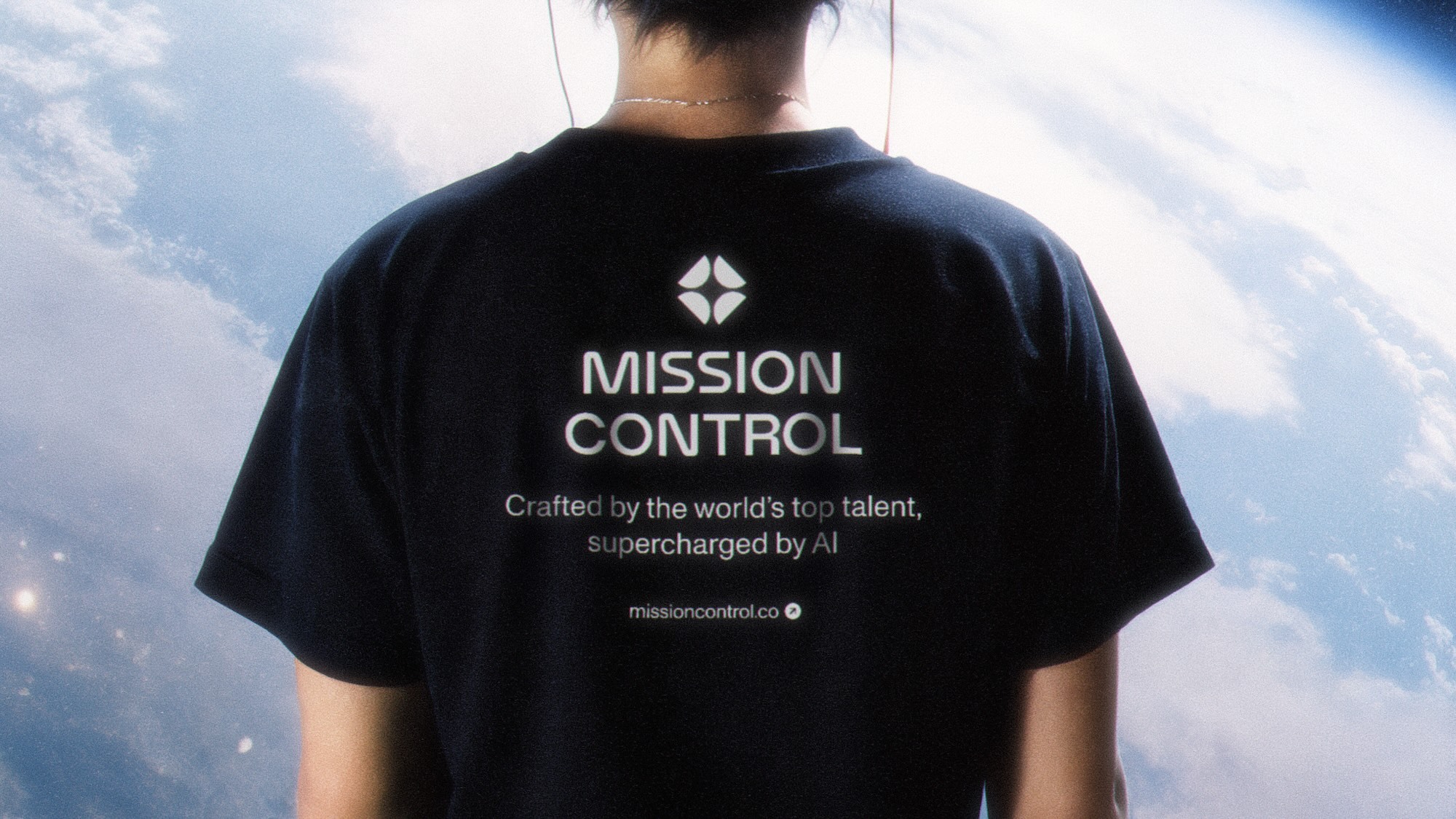 A Mission Control T-shirt against a blue sky